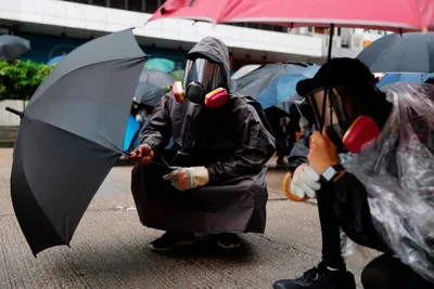 thousands defy anti mask law and march in hong kong