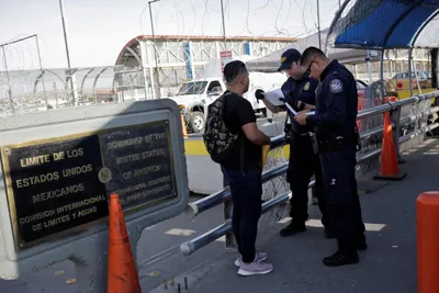 as new policy takes effect  asylum seekers anxiously cross into us