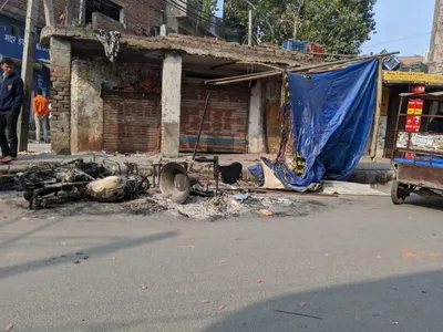 delhi ground report  stone pelting  arson continues in ghonda  police stand by
