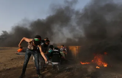 dozens of palestinians injured by fresh round of israeli gunfire  tear gas