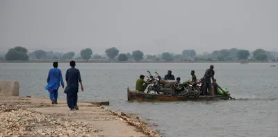 pakistan races to keep floodwaters out of power station that supplies millions
