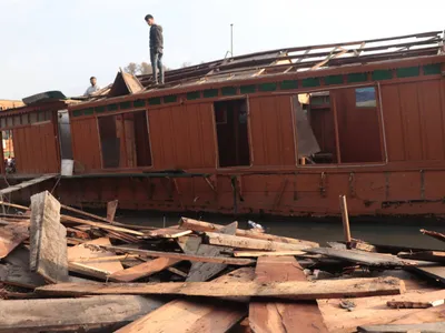 sinking ship  kashmir s ban on repair of houseboats is leaving owners without a livelihood