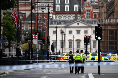 man arrested  pedestrians injured as car hits barriers at uk parliament