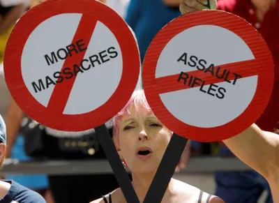 firearms debate rages as florida rally coincides with gun show