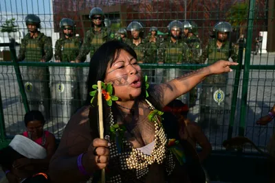 in another protest  indigenous people block entrance to cop30 summit