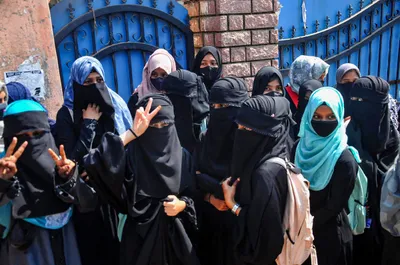karnataka  nine suspended after  allowing  hijab clad girls to appear for sslc exams