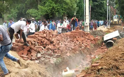 the boundary wall at bengal s visva bharati campus is another chapter in  mamata vs bjp 
