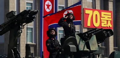 north korea holds military parade  no long range missiles on display