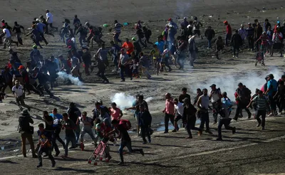 us fires tear gas into mexico to repel migrants  closes border gate for several hours
