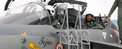 in a first  defence minister flies in indigenously built light combat tejas fighter