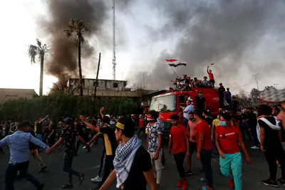 basra airport targeted by rocket fire as violent protests grip iraq