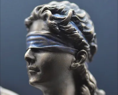 how we marginalise disabled experiences when we speak of the blindfold of lady justice