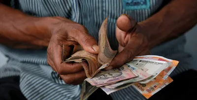 rupee hits a record low  dealers say rbi intervention mild
