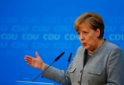 in bid to secure fourth term  cornered angela merkel launches talks with social democrats