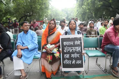watch   hundreds come together to protest manual scavengers  deaths