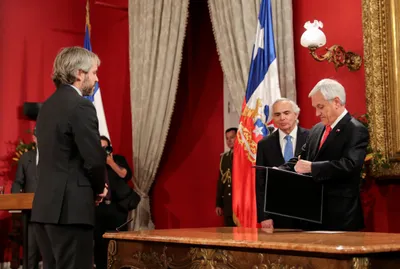 chilean president sebastian pinera faces new protests after firing ministers