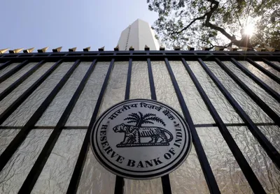 in surprise move  rbi leaves interest rates unchanged  rupee slips below 74 mark