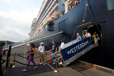china reports 5 000 new coronavirus cases  cruise ship disembarks in cambodia