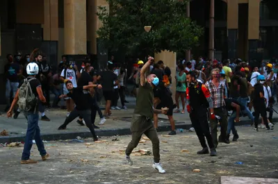 beirut  police tear gas anti govt protesters  2 ministers quit over explosion