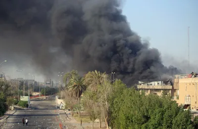 violent protests in the iraqi city of basra  protesters set government offices ablaze