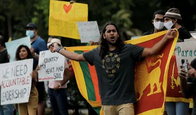 rajapaksa revokes emergency as 14 members of ruling coalition refuse to back motion