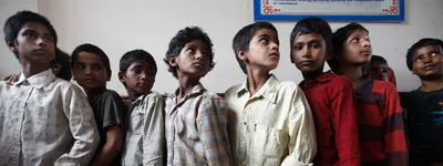 why does maneka gandhi want to shift child adoption from courts to district collectors 