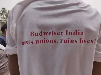 employees allege ‘witch hunt’ of union members at budweiser brewery near delhi