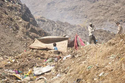 under ahmedabad s mounting garbage  it s the migrant worker who is crumbling