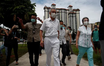 despite covid 19  long lines as singaporeans vote in masks