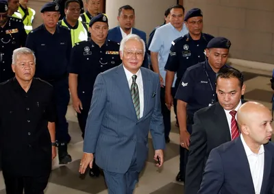 malaysia s former pm najib charged with three counts of money laundering