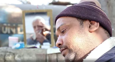 watch  life as a street side barber in new delhi