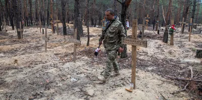 hundreds found in mass grave after russians leave ukraine city