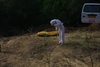 in photos  the process of burying a deceased coronavirus patient