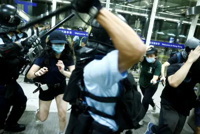 hong kong protesters offer apologies  china doubles down after airport clash