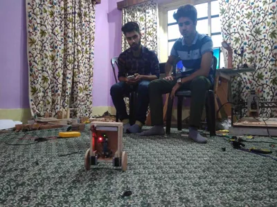 from the embattled lanes of srinagar  two young men have taught themselves how to build robots